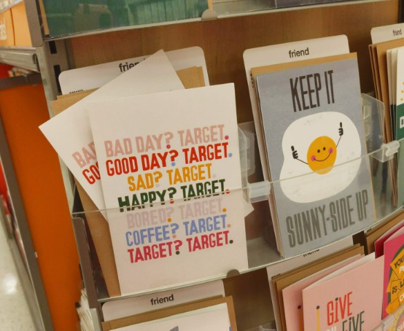A display of greeting cards at Target, featuring one card that jokes about excessive Target shopping