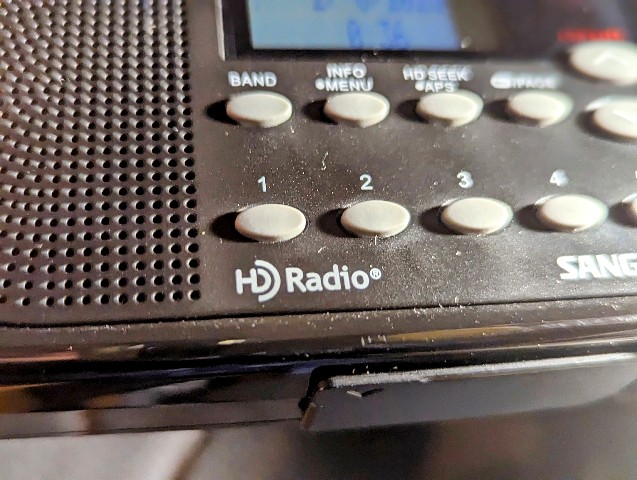 A portable radio receiver featuring the HD Radio trademark logo