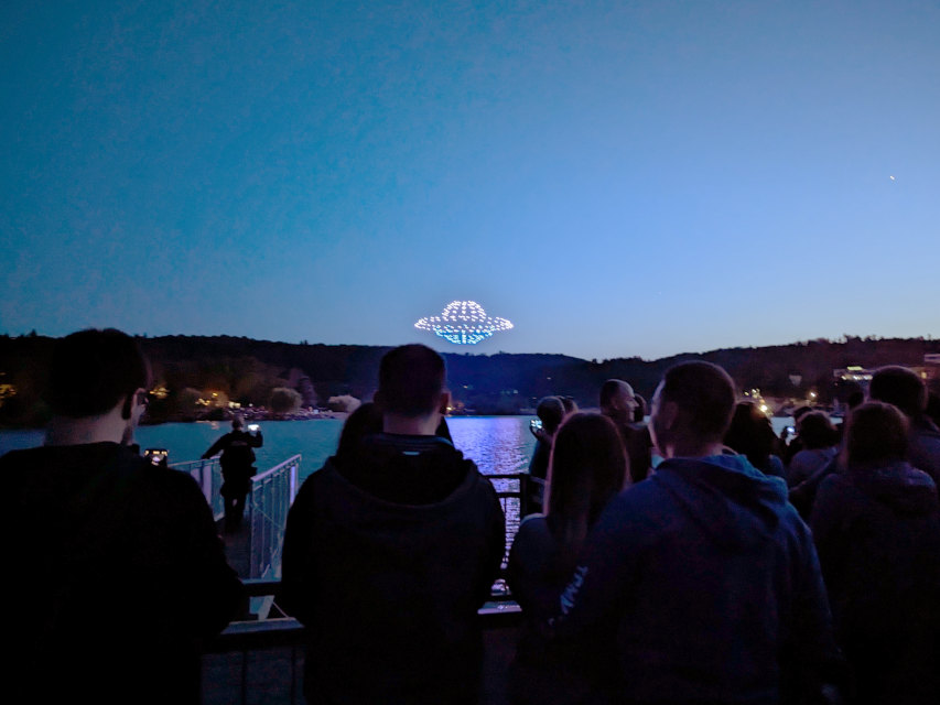 Light show drones forming a flying saucer over Brno Reservoir